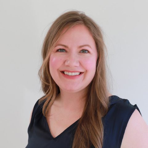 Smiling headshot of Jaclyn Stewart who is a white woman.